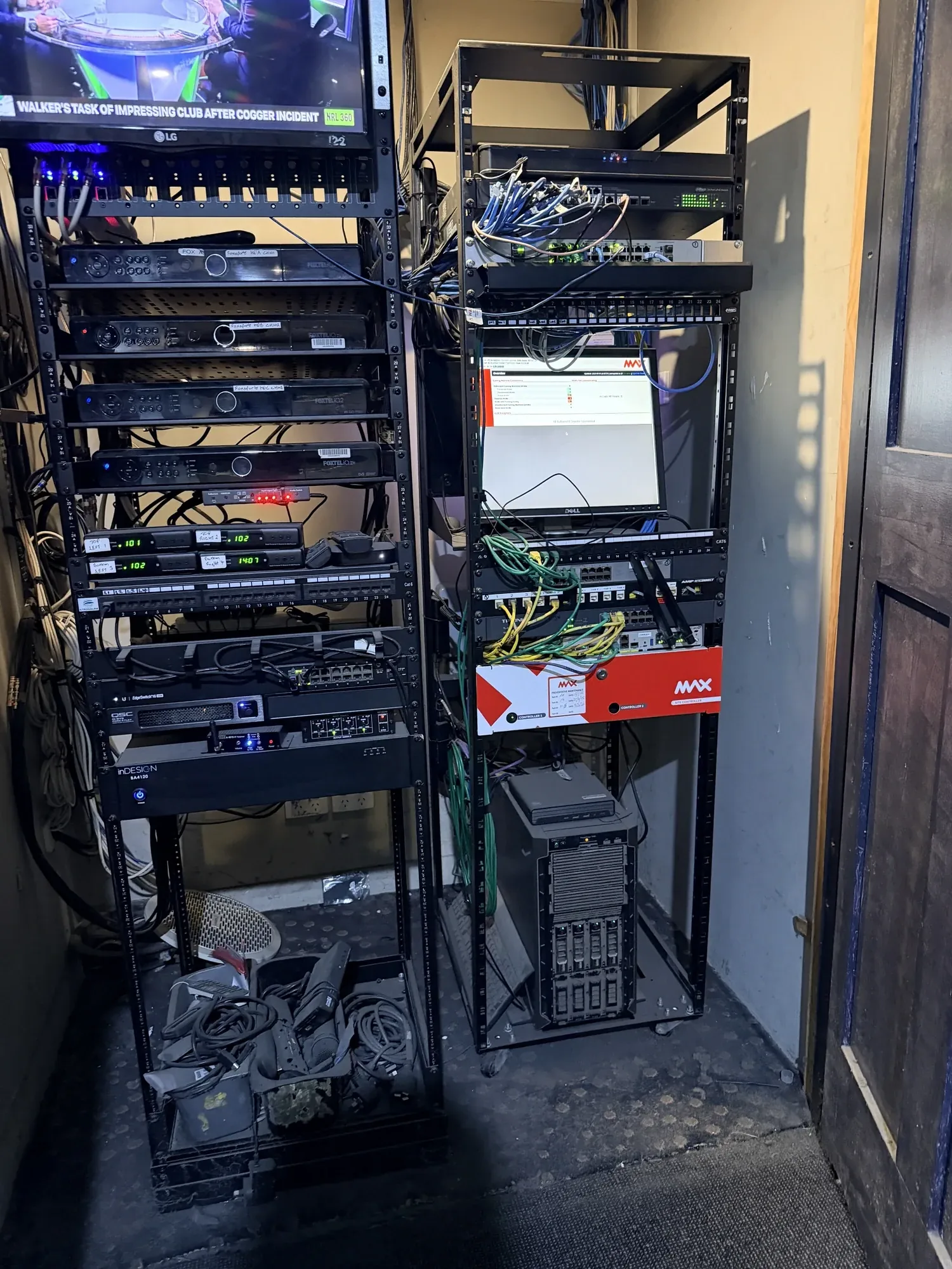 Netlink completed commercial data rack — Cat6 patch panels and media players in a Hunter Valley hospitality venue