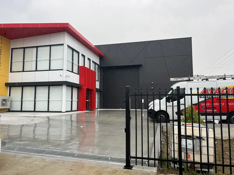 Netlink commercial CCTV camera install on a Newcastle & Hunter industrial building exterior — perimeter surveillance for a light-industrial site